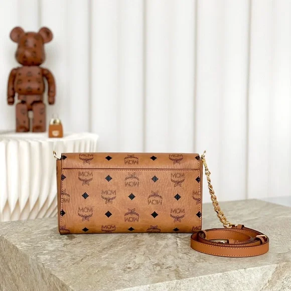 MCM Tan Monogram Clutch with Gold Accent - Picture 4 of 9